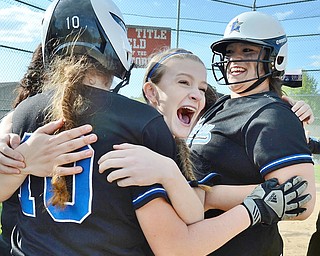 Jeff Lange | The Vindicator  THU, MAY 19, 2016 - Lakeview freshman Meg Stein (center) celebrates with Beady Titus (10) and Tori Wells after the Bulldogs defeated Hubbard 4-3 in a Division II district championship game at Alliance High School Thursday night.