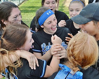 Jeff Lange | The Vindicator  THU, MAY 19, 2016 - Winning pitcher Cait Kelm (center) is mobbed by Bulldog teammates after pitching a complete game against Hubbard in a Division II district final at Alliance High School on Thursday. Lakeview defeated Hubbard 4-3.