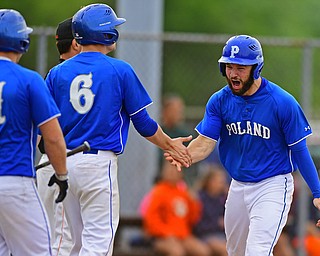 STRUTHERS, OHIO - MAY 20, 2016: Anthony Calcagni #4 of Poland is congratulated by teammates Jared Burkert #6 and Padraig O'Shaughnessy #21 after scoring a run in the fifth inning of Friday nights game at Cene Park. Poland Won 7-6. DAVID DERMER | THE VINDICATOR