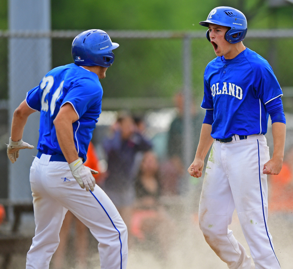 STRUTHERS, OHIO - MAY 20, 2016: Jared Burkert #6 of Poland celebrates with teammate Tony Chairo #20 after scoring the go ahead run in the sixth inning of Friday nights game at Cene Park. Poland Won 7-6. DAVID DERMER | THE VINDICATOR