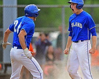 STRUTHERS, OHIO - MAY 20, 2016: Jared Burkert #6 of Poland celebrates with teammate Tony Chairo #20 after scoring the go ahead run in the sixth inning of Friday nights game at Cene Park. Poland Won 7-6. DAVID DERMER | THE VINDICATOR