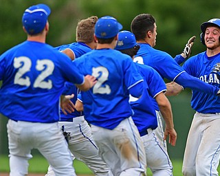 STRUTHERS, OHIO - MAY 20, 2016: Dan Klase #24 of Poland is mobbed by his teammates after driving in the game winning run in the bottom of the seventh inning of Friday nights game at Cene Park. Poland Won 7-6. DAVID DERMER | THE VINDICATOR