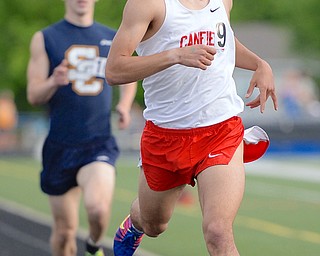 Jeff Lange | The Vindicator  FRI, MAY 20, 2016 - Canfield's Chase Kern (9) finishes the final 100 meters of the boys 1,600 meter run during Friday night's Division district track meet at Austintown Fitch High School. Kern took first in the event with a time of 4:22.56.