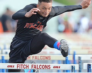 Jeff Lange | The Vindicator  FRI, MAY 20, 2016 - Howland's Jacob Williams clears a hurdle in the boys 110 meter hurdles event during Friday's Division district track meet at Fitch High School.
