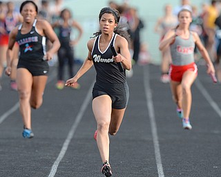 Jeff Lange | The Vindicator  FRI, MAY 20, 2016 - Warren Harding's Justice Richardson (center) sprints to the finish line in the girls 4x100 meter relay during Friday's Division district track meet at Austintown Fitch High School.