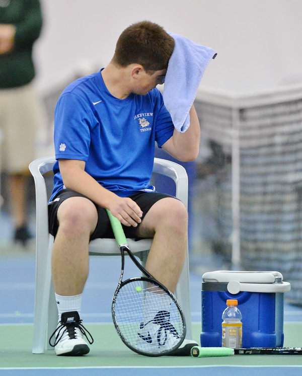 Jeff Lange | The Vindicator  SAT, MAY 14, 2016 - Lakeview's Zack Teffner wipes the sweat from his forehead in between sets during Saturday's tennis match at Boardman Tennis Center.