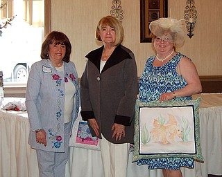 SPECIAL TO THE VINDICATOR
The Niles Chapter of the American Sewing Guild had its 14th annual style show, “The Extravaganza,” on April 30 at A La Cart Catering in Canfield. Prizes were awarded for best garment, best quilt and best miscellaneous item. Winners, from left, were Patti Augustine for her sewing-related embroidered quilt, Barbara Rosier-Tryon for a coat made of neoprene fabric and Denise Cline for her hand-painted pillow. Since the Niles Chapter will be celebrating its 25th anniversary, prizes were also awarded for items made 25 years ago. First place went to Barbara Springer; second, Sandy Rosier; and third, Pam Sullivan.