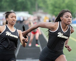 William D Lews The Vindicator   Warren's KaÕNaylah Cox hands off to Aisha Jackson during 4x200 during regional meet at Fitch 5-25-16
