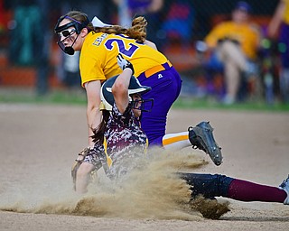 MASSILLON, OHIO - MAY 25, 2016: Felicia Gaeta #1 of South Range slides into third base after third basemen Abby White #25 of Champion misplayed the throw from the catcher in the first inning of Wednesday nights Regional Semi-Final game at Massillon Washington High School. DAVID DERMER | THE VINDICATOR