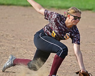 MASSILLON, OHIO - MAY 25, 2016: Second basemen Lydia Baird #2 of South Range traps the ball in her glove before throwing it to first for the out in the third inning of Wednesday nights Regional Semi-Final game at Massillon Washington High School. DAVID DERMER | THE VINDICATOR
