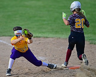 MASSILLON, OHIO - MAY 25, 2016: Carissa Hurst #33 of Champion keeps her foot on the bag to force out Morgan Czopur #20 of South Range in the fourth inning of Wednesday nights Regional Semi-Final game at Massillon Washington High School. DAVID DERMER | THE VINDICATOR