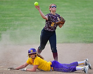 MASSILLON, OHIO - MAY 25, 2016: Lydia Baird #2 of South Range throws the ball home after after unsuccessfully attempting to tag out McKenzie Zigmont #3 of Champion in the fourth inning of Wednesday nights Regional Semi-Final game at Massillon Washington High School. DAVID DERMER | THE VINDICATOR