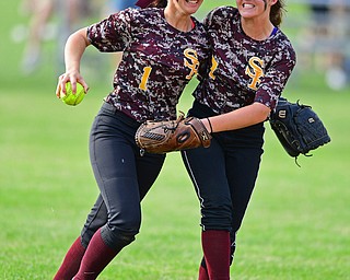MASSILLON, OHIO - MAY 25, 2016: Felicia Gaeta (left) and Caragyn Yanek (right) celebrate in shallow center field after Gaeta caught the final out of the game in the seventh inning of Wednesday nights Regional Semi-Final game at Massillon Washington High School. DAVID DERMER | THE VINDICATOR