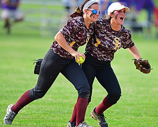 MASSILLON, OHIO - MAY 25, 2016: Felicia Gaeta (left) and Caragyn Yanek (right) celebrate in shallow center field after Gaeta caught the final out of the game in the seventh inning of Wednesday nights Regional Semi-Final game at Massillon Washington High School. DAVID DERMER | THE VINDICATOR