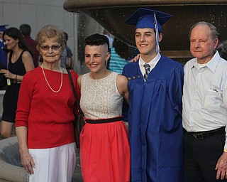 Nikos Frazier | The Youngstown Vindicator..(left to rigth) Shirley McConnell, Christina Leckfor, Michael Leckfor, and Bud McConnell pose for a picture outside Stambaugh Auditorium after Michael recieved his diploma from Hubbard High School.