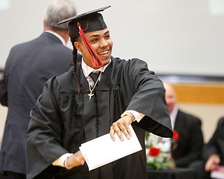            ROBERT  K. YOSAY | THE VINDICATOR..ready to dance..... Jose Carrion -  picks up his diploma... and does a little dance..The Campbell Red Devils  graduated 73 students at ceremonies at the school gym Thursday Evening...-30-