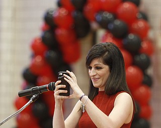            ROBERT  K. YOSAY | THE VINDICATOR..Speaking words of wisdom   Ms Maria Rohan clas of 2005 - as she takes a snapchat of the event..The Campbell Red Devils  graduated 73 students at ceremonies at the school gym Thursday Evening...-30-