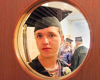 William d Lewis The Vindicator   Harding grad JoshuaDarbey is framed ina winow while waiting for Hardiong commencement to get underway 5-26-16 at Packard Music Hall in Warren.