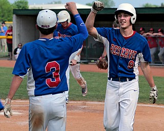 05-26-16- BASEBALL- Regional Semi Final D4- Lorain, OH, USA; BASEBALL-Western Reserve Blue Devils vs Sycamore Mohawks Warriors at The Pipe Yard Stadium Powered by FirstEnergy Solutions..Bottom 5th inning, after scoring, Western Reserve Blue Devils Wyatt Larimer (9) celebrates with his teammate Ryan Demsky (3). The Western Reserve Blue Devils beat Sycamore Mohawks Warriors 6-0.    Mandatory Credit: Michael Taylor-Youngstown Vindicator