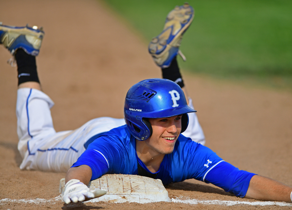 HUDSON, OHIO - MAY 26, 2016: Eric White #2 of Poland slides smiles after sliding headfirst into third base for a triple in the first inning of Thursday afternoons Division 2 Regional Semi-Final game at the Ballpark at Hudson. Poland won 8-2. DAVID DERMER | THE VINDICATOR