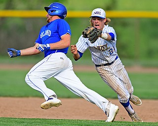 HUDSON, OHIO - MAY 26, 2016: Dan Klase #24 of Poland avoids a would be tag from second basemen Sam Frontine #21 of NDCL to avoid being picked off in the second inning of Thursday afternoons Division 2 Regional Semi-Final game at the Ballpark at Hudson. Poland won 8-2. DAVID DERMER | THE VINDICATOR