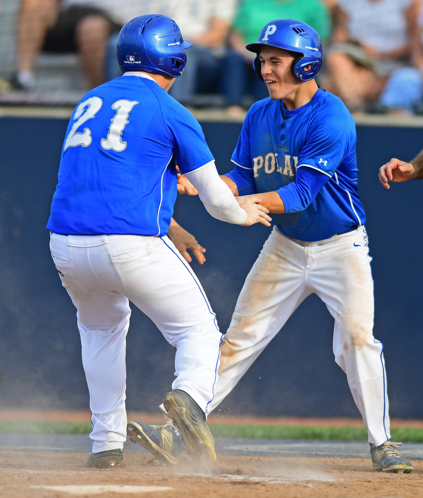 HUDSON, OHIO - MAY 26, 2016: Eric White #2 (right) congratulates teammate Pad O'Shaughnessy #21 after they both scored runs in the third inning of Thursday afternoons Division 2 Regional Semi-Final game at the Ballpark at Hudson. Poland won 8-2. DAVID DERMER | THE VINDICATOR
