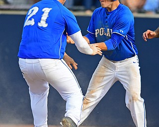 HUDSON, OHIO - MAY 26, 2016: Eric White #2 (right) congratulates teammate Pad O'Shaughnessy #21 after they both scored runs in the third inning of Thursday afternoons Division 2 Regional Semi-Final game at the Ballpark at Hudson. Poland won 8-2. DAVID DERMER | THE VINDICATOR