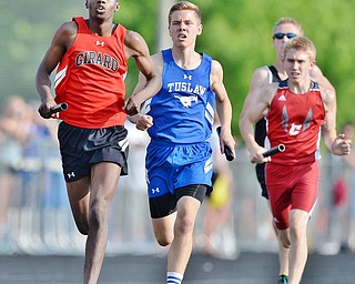 Jeff Lange | The Vindicator  THU, MAY 26, 2016 - Girard's Micah Jones (left) leads a group of runners during the boys 4x800 meter relay race during the Division II regional track meet at Austintown Fitch High School on Thursday.