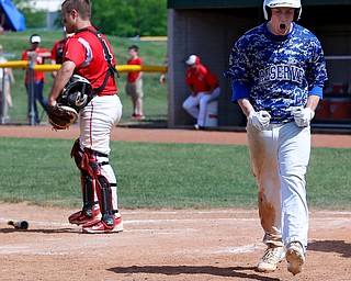 052716 - Western Reserve's Jeep celebrates a run in the first inning of Friday's Division IV regional final against Cuyahoga Heights at The Pipe Yard in Lorain. The Blue Devils fell to the Redskins 6-5. Michael Taylor | The Vindicator.