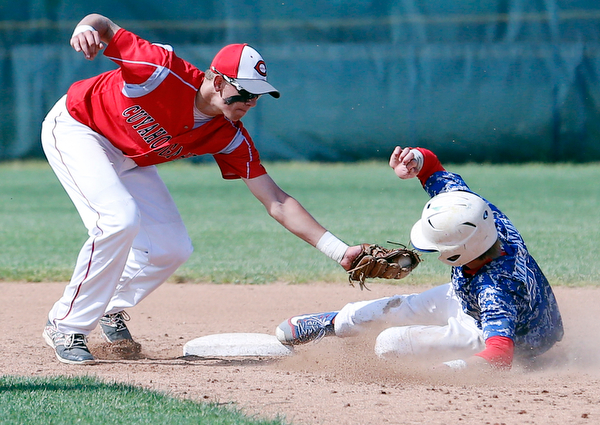 052716 - Western Reserve's Walker steals third in the fourth inning of Friday's Division IV regional final against Cuyahoga Heights at The Pipe Yard in Lorain. The Blue Devils fell to the Redskins 6-5. Michael Taylor | The Vindicator