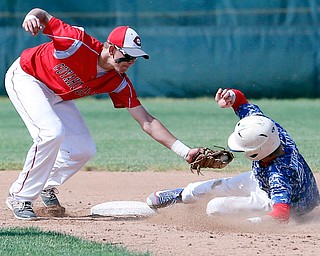 052716 - Western Reserve's Walker steals third in the fourth inning of Friday's Division IV regional final against Cuyahoga Heights at The Pipe Yard in Lorain. The Blue Devils fell to the Redskins 6-5. Michael Taylor | The Vindicator