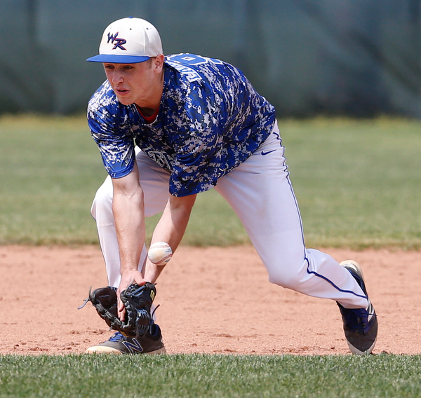 052716 - Western Reserve's Wyatt Larimer (9) miss plays a ground ball during Friday's Division IV regional final against Cuyahoga Heights at The Pipe Yard in Lorain. The Blue Devils fell to the Redskins 6-5. Michael Taylor | The Vindicator