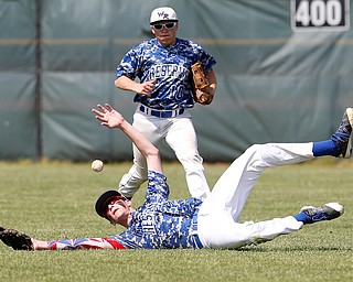 052716 - Western Reserve's Dom Velasquez (24) dives trying to catch a fly ball during Friday's Division IV regional final against Cuyahoga Heights at The Pipe Yard in Lorain. The Blue Devils fell to the Redskins 6-5. Michael Taylor | The Vindicator