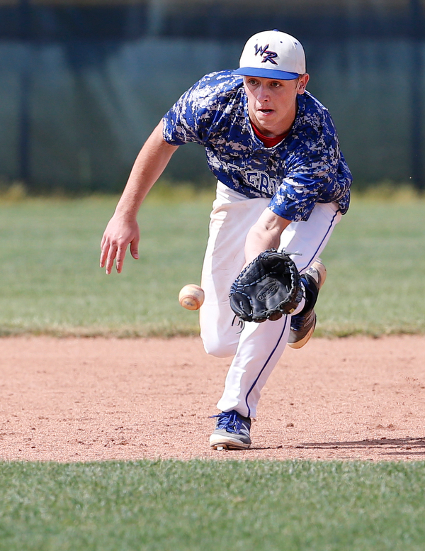 052716 - Western Reserve's Wyatt Larimer (9) fields a ground ball during the fifth inning of  Friday's Division IV regional final against Cuyahoga Heights at The Pipe Yard in Lorain. The Blue Devils fell to the Redskins 6-5. Michael Taylor | The Vindicator
