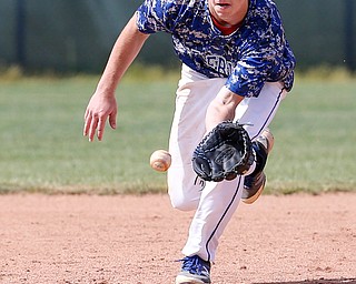 052716 - Western Reserve's Wyatt Larimer (9) fields a ground ball during the fifth inning of  Friday's Division IV regional final against Cuyahoga Heights at The Pipe Yard in Lorain. The Blue Devils fell to the Redskins 6-5. Michael Taylor | The Vindicator