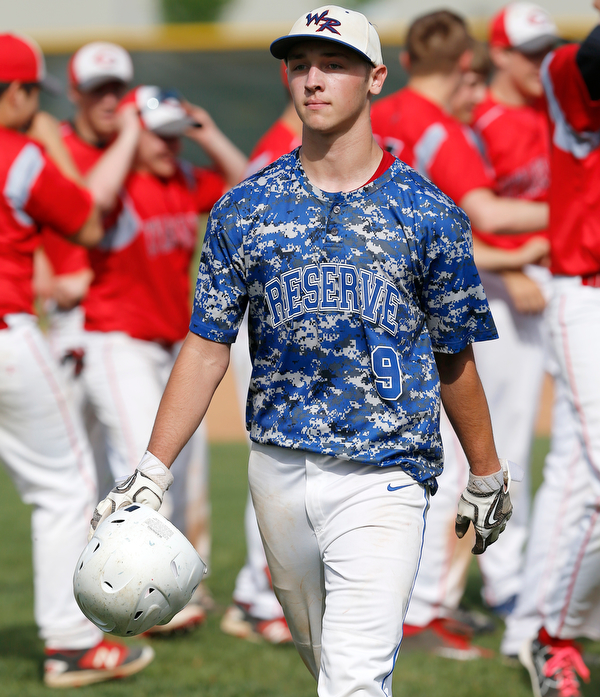 052716 - Western Reserve's Wyatt Larimer talks back to his team as Cuyahoga Heights celebrates in the background after Friday's Division IV regional final against Cuyahoga Heights at The Pipe Yard in Lorain. The Blue Devils fell to the Redskins 6-5. Michael Taylor | The Vindicator.