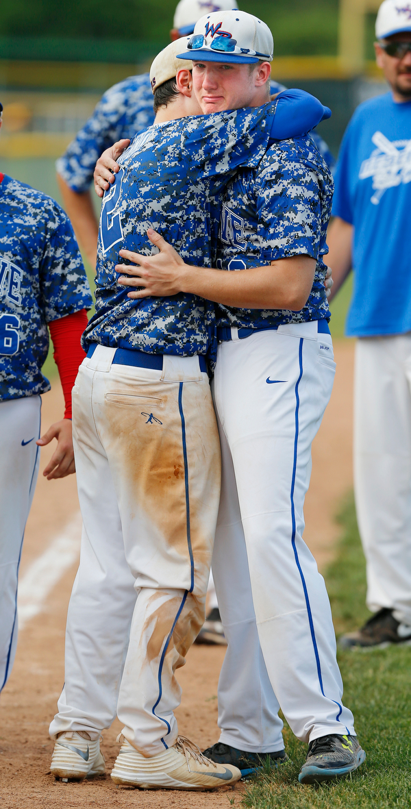 052716 - Western Reserve's teammates Jeep DiCioccio (2)(left) and, senior, Jake Clark (13) share a hug after their loss to Cuyahoga Heights Redskins 6-5.