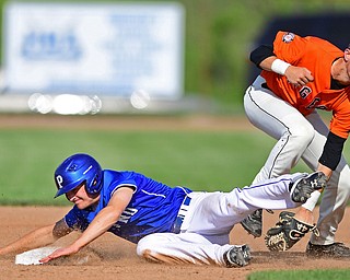 HUDSON, OHIO - MAY27, 2016: Jared Burkert #6 of Poland slides into second base avoiding the tag from Adam Bencko #2 of Chagrin Falls after almost being picked off in the second inning of Friday afternoons Division Two Regional Final at the Ballpark at Hudson. Poland won 13-3. DAVID DERMER | THE VINDICATOR..