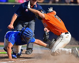 HUDSON, OHIO - MAY27, 2016: Catcher Nick Petrolla #23 of Poland tags out Tyler Zaluski #18 of Chagrin Falls at home preventing him from scoring in the second inning of Friday afternoons Division Two Regional Final at the Ballpark at Hudson. Poland won 13-3. DAVID DERMER | THE VINDICATOR..