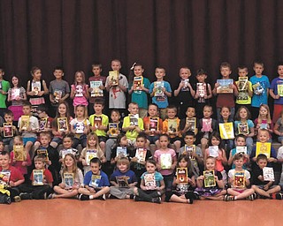 SPECIAL TO THE VINDICATOR: First-graders at Newton Falls Elementary received new books from the Newton Falls Kiwanis Club on May 12 as part of the club’s annual summer reading event. The Kiwanis Club serves children around the world through local communities hosting programs such as this and Junior Olympics.