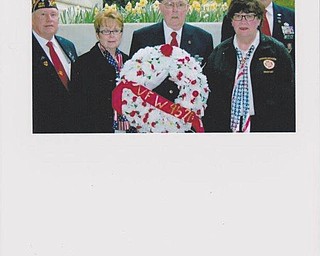 Special to The Vindicator : 
Several members of the Veterans of Foreign Wars Post 9571 and its auxiliary recently traveled to Washington, D.C., to place a wreath at the Tomb of the Unknown Solider at Arlington National Cemetery. The wreath was made by Carol Check, auxiliary secretary, and included white carnations; a single red rose, in remembrance of prisoners of war and those missing in action; red buddy poppies, the official memorial flower of the VFW; and a red ribbon streamer that displayed VFW 9571. Check was joined by John Craig and Ray Schafer, post adjutant and quartermaster, and Cathy Schafer, auxiliary president for the presentation. Post members Tom Check, Larry Truitt and Donna McDaniel also attended. Shown from left with the wreath are Ray and Cathy Schafer, Craig, and Carol and Tom Check.



