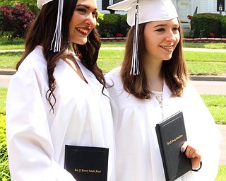 Nikos Frazier | The  Vindicator.Alexandra Hernandez(left) and Sarah Stiffler(right) pose for pictures outside of Packard Music Hall after recieving their diplomas from John F. Kennedy Catholic School on Saturday, May 28, 2016.