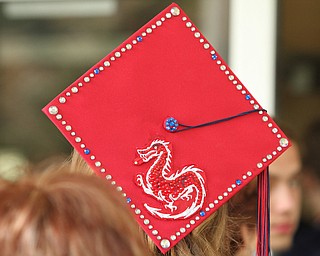 Nikos Frazier | The  Vindicator.Kaitlyn Palmer, adorns her cap with a red dragon, the mascot of Niles McKinley High School.