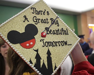 Nikos Frazier | The  Vindicator."THere's a great big beautiful tomorrow," is written on a graduating Niles McKinley student's cap in Packard Music Hall.