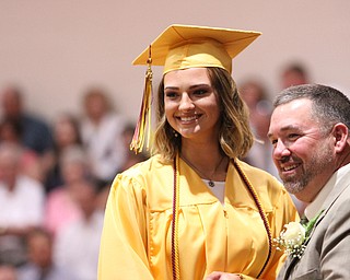Nikos Frazier | The  Vindicator.Kalina Wisniewki(left) shakes Ralph Wince's hand after receiving her diploma at the 2016 South Range High School commencement ceremonies on Saturday, May 28, 2016. Wince is the President of the South Range Board of Education.