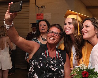 Nikos Frazier | The  Vindicator.Lynne Ritter(center) smiles as her aunts, Joanie Murphy(left) and Liz Phillips snap a selfie after the 2016 South Range High School commencement ceremonies.