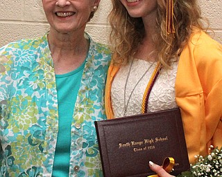 Nikos Frazier | The  Vindicator.Charli Littleton(right) smiles next to her grandmother, Bonnie Pearce(left) after the 2016 South Range High School commencement ceremonies.