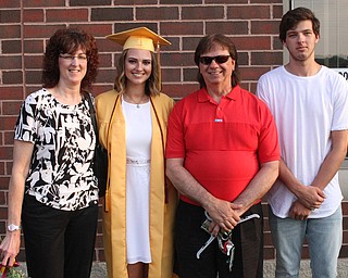 Nikos Frazier | The  Vindicator.Kalina Wisniewski(center left) poses for a photo with her family after receiving her diploma from South Range High School.