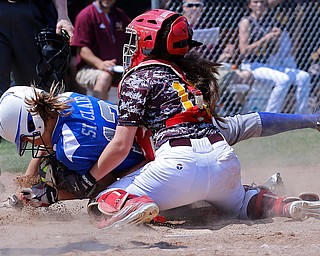 05282016- South Range Raiders' catcher Hanna Dennison (16) tags out Northwestern Huskies' Ally St. Clair in the Division III regional finals against Northwestern. The South Range Raiders would go on to win 1-0 at Massillon Washington High School. Michael Taylor | The Vindicator.