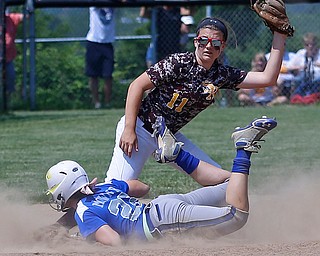 05282016- South Range Raiders' Morgan Smith (11) tags out Northwestern Huskies' Jewelia Mower on a stolen base attempt in the Division III regional finals against Northwestern. The South Range Raiders would go on to win 1-0 at Massillon Washington High School. Michael Taylor | The Vindicator.
